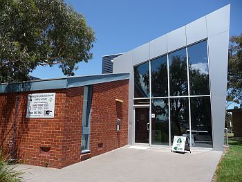 Front of our building with sign and entrance